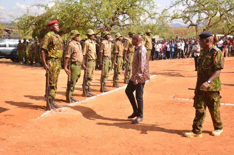 Interior CS Kithure Kindiki inspects a guard of honour by Kenya Police Reservists at Aramat in Isiolo county