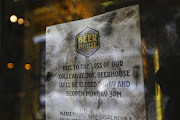 Beerhouse front entrance were bouncer, Joe-louis Kanyona was stabbed to death on Saturday night at around 10pm. Covered in police fingerprint powder, The notice on the door reads 