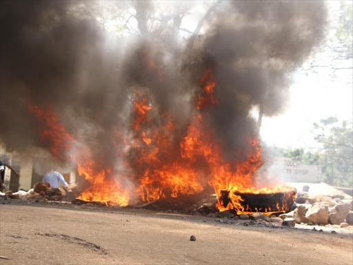 A bonfire lit by demonstrators in Migori town after the Supreme Court upheld Presdient Uhuru Kenyatta's win, November 20, 2017. /MANUEL ODENY