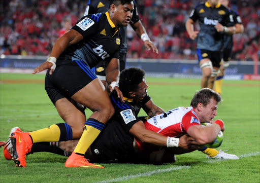 Ruan Combrinck of the Lions dives over for his try during the Super Rugby match between Emirates Lions and Hurricanes at Emirates Airline Park on February 13, 2015 in Johannesburg, South Africa. Combrinck scored a late try to lift the visitors to a 13-10 win over the Blues in Super Rugby on Saturday 7 March 2015, ending the Johannesburg team's winless start to the season and extending the Auckland outfit's losing streak to four games. (Photo by Duif du Toit/Gallo Images)