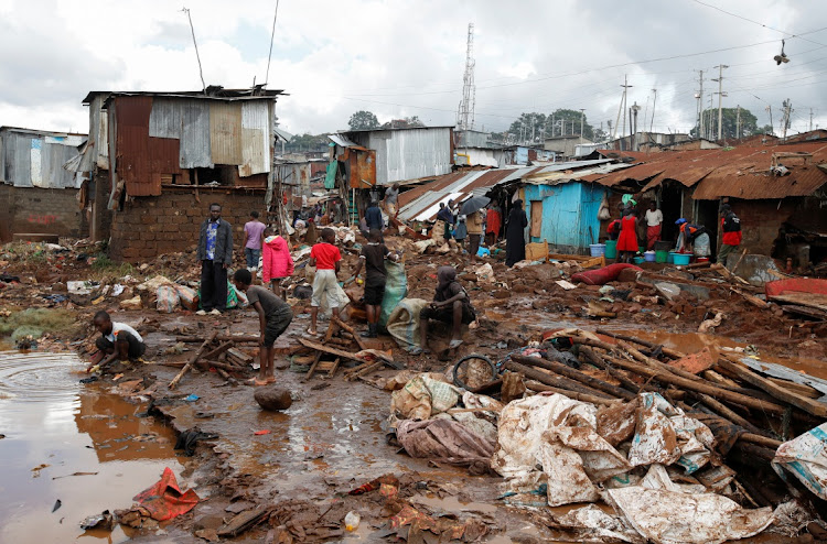 Residents sift through the rubble as they recover their belongings after the Nairobi river burst its banks and destroyed their homes within the Mathare Valley settlement in Nairobi, Kenya April 25, 2024.