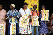 Dipuo Difedile club members in Orlando West show gifts distributed at
their stokvel.