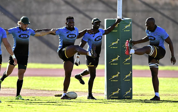 The Springboks practice at the Gelvandale sports grounds on Women's Day, with the stands filled with supporters.