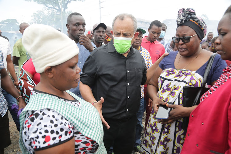 Businessman Suleiman Shahbal at the razed mitumba section of Kongowea market on Tuesday.