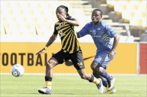 TOIL PAYS OFF: Kaizer Chiefs' Siphiwe Tshabalala, left, and Platinum Stars' Thuso Phala fight for the ball during their Telkom Knockout match at Royal Bafokeng Stadium in Rustenburg yesterday. Photo: Gallo Images