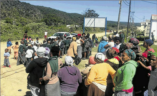 Reeston parents, upset with the conduct of taxi operators involved in scholar transport, have called on the transport department to replace taxis with buses Picture: MAMELA GOWA