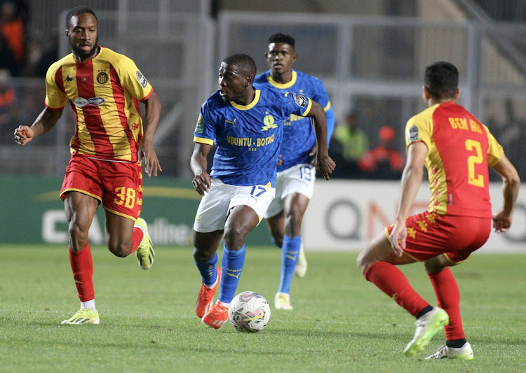Aubrey Modiba of Mamelodi Sundowns is challenged by Roger Aholou of Esperance Tunis in the Caf Champions League semifinal first leg match at Stade Olympique Hammadi Agrebi in Tunis, Tunisia on Saturday night.