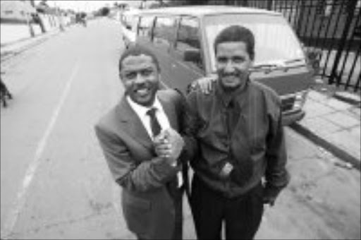 HERO: Taxi driver Oliver Easton, right, was honoured by Gauteng transport MEC Ignatius Jacobs after he rescued people from a fire at the Coronation Hospital. Pic. Veli Nhlapo. 08/11/07. © Sowetan.