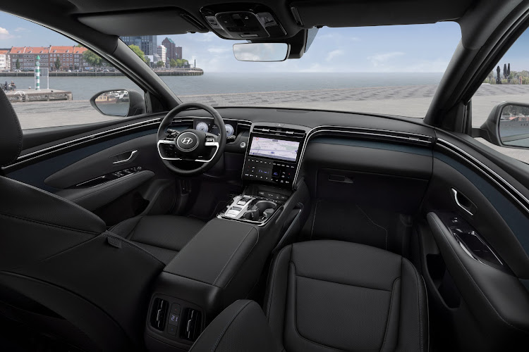 The broad ridge of the dashboard blends with the doors, wrapping around front occupants. Picture: SUPPLIED