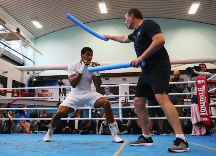 Anthony Joshua takes part in a training session with trainer Rob McCracken during the Anthony Joshua Media Day at English Institute of Sport on September 12, 2018 in Sheffield, England.