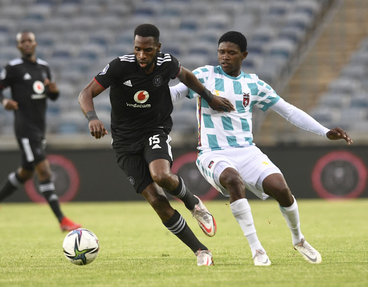 Fortune Makaringe of Orlando Pirates challenges Bathusi Aubass of TS Galaxy during the DStv Premiership match between Orlando Pirates and TS Galaxy at Orlando Stadium on December 11, 2021 in Johannesburg, South Africa.