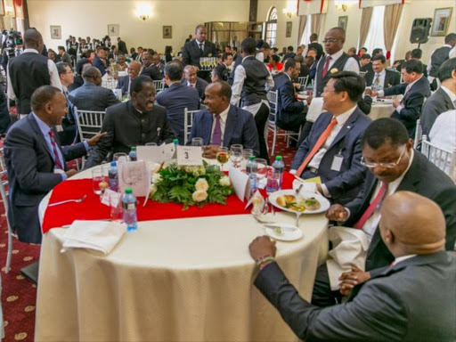 Interior CS Joseph Nkaissery, Cord leader Raila Odinga and Majority leader Aden Duale smiling and chatting when they were invited for a luncheon in honor of the South Korean President H.E. Park Geun-hye at State House, Nairobi.Photo/PSCU