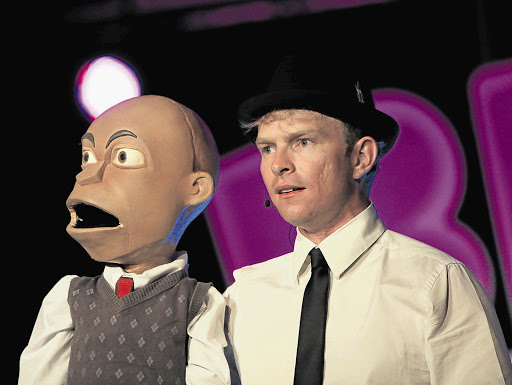 PUPPET OF THE WHITE MAN: Chester Missing, (with his behind-the-scenes man Conrad Koch) at a comedy show at Emperors Palace