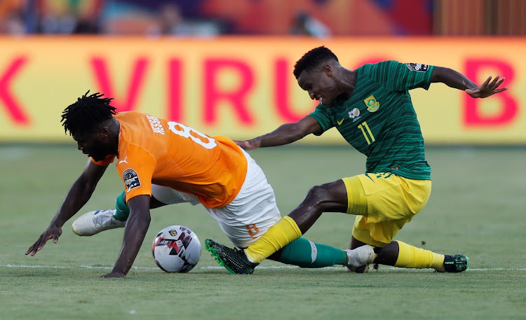 South Africa's Themba Zwane goes in with a challenge on Ivory Coast's Franck Kessie during their Afcon Group D match at Al Salam Stadium in Cairo, Egypt, on June 24 2019.