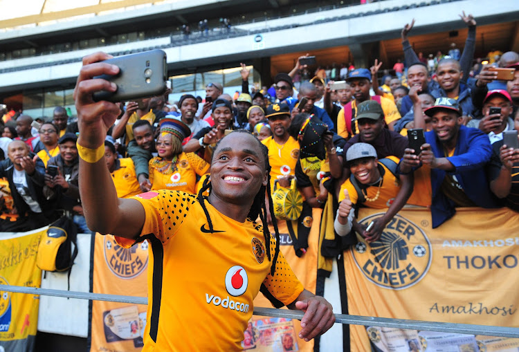 Siphiwe Tshabalala of Kaizer Chiefs takes a selfie with fans after the Absa Premiership 2017/18 game between Ajax Cape Town and Kaizer Chiefs at Cape Town Stadium on 12 May 2018.