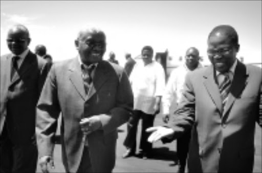 COOPERATION: KwaZulu-Natal Premier Sbusiso Ndebele and Mozambique's President Armando Guebuza arrive at the Newcastle airport during thier visit to Arcelormittal South Africa yesterday. 11/11/2008. Pic. Siyabonga Mosunkutu. © Sowetan.