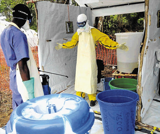 TOUR OF DUTY: Gilles van Cutsem, Médecins Sans Frontières' medical co-ordinator for South Africa and Lesotho, in Liberia dressed in a protective suit