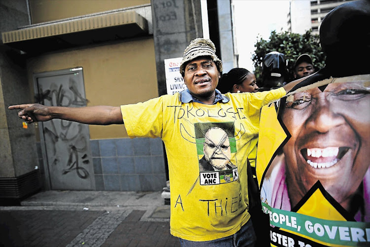 A man wears an anti-Zuma T-shirt outside Luthuli House in Johannesburg on September 5 2016.
