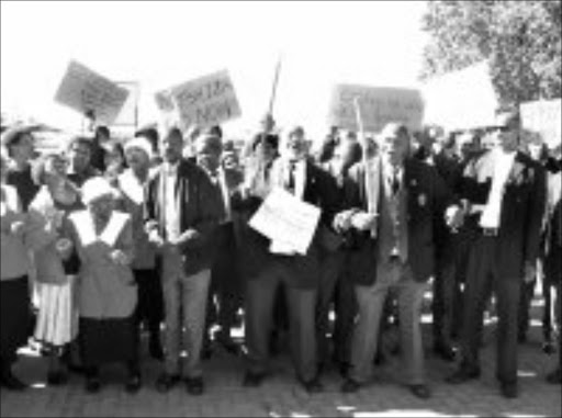 HOLY WAR: Congregants from the Methodist Church in Zola, Soweto, march to demand the removal of Reverend Zola Mtshiza from the circuit. Mtshiza is accused of running the church as his own entity. Pic. Bafana Mahlangu. 05/2008. © Sowetan