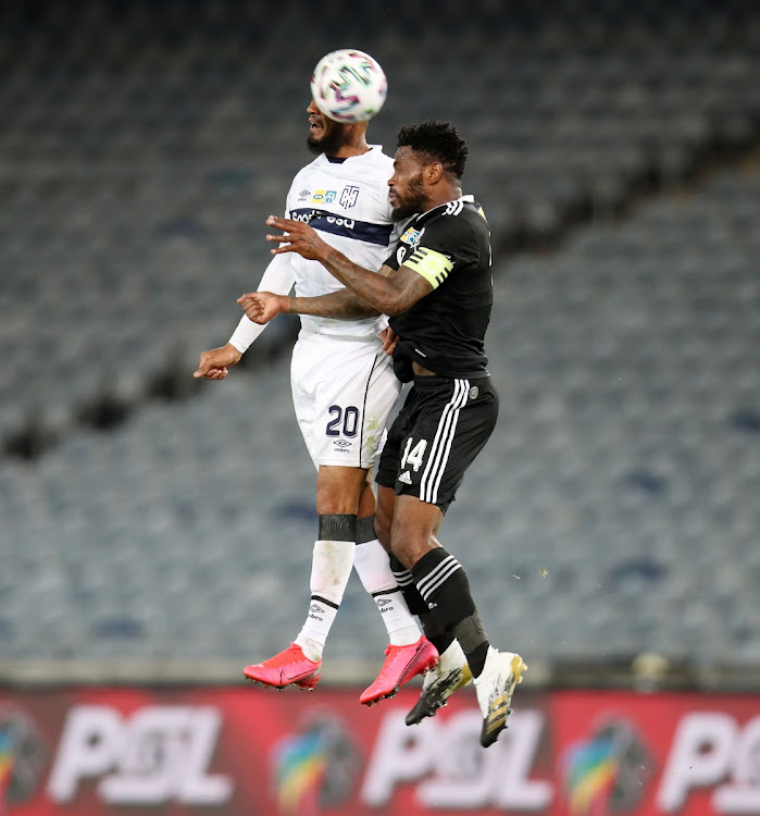 Tasherrq Morris of Cape Town City challenged by Thulani Hlatshwayo of Orlando Pirates.