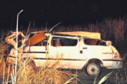 KILLER TAXI: This taxi burst a tyre and rolled into a ditch, killing three people in Krugersdorp on Saturday night. 21/12/08. Photo: Snega Manego Konyana. © Unknown.