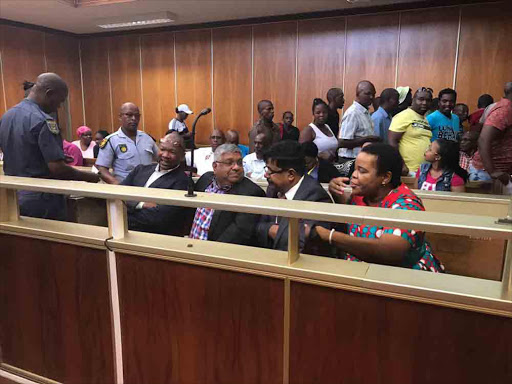 From left to right Thembelani Sali, Vincent Pillay, Matthew Moodley and Luleka Ndzele in the East London Magistrate's Court today. Picture: ZWANGA MUKHUTHU