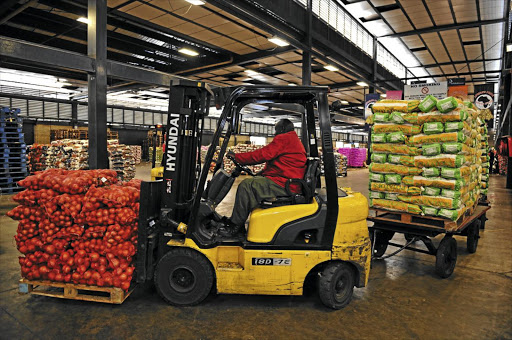 EASY ON THE PALLET: Onions and potatoes on the move at Joburg Market, formerly the Johannesburg Fresh Produce Market, which serves about 5000 South African farmers.
