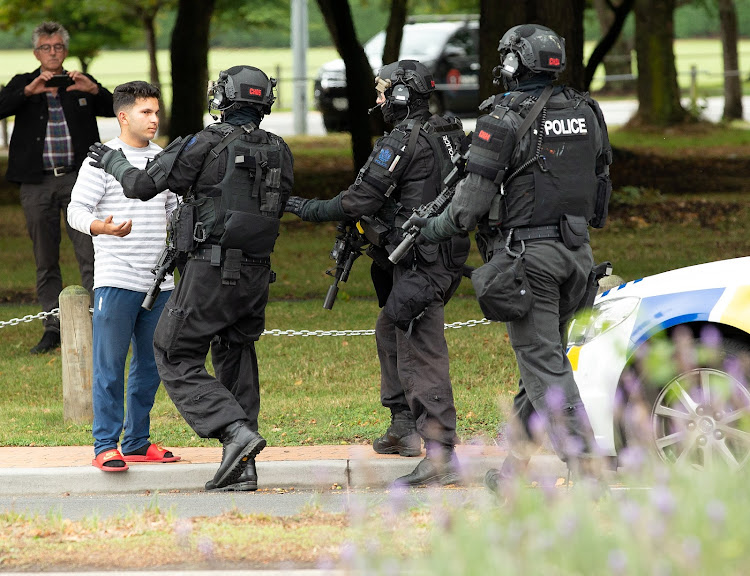 AOS (Armed Offenders Squad) push back members of the public following a shooting at the Masjid Al Noor mosque in Christchurch, New Zealand,, March 15, 2019.
