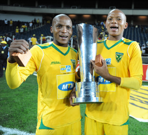 Richard Henyekane and his brother Joseph celebrates winning the MTN 8 during the MTN8 final match beween Golden Arrows and Ajax Cape Town from Orlando Stadium on October 24, 2009 in Johannesburg, South Africa. Picture credits: Gallo Images