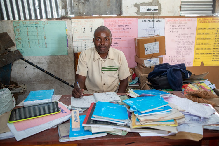 Umuru Jalua showcases some of the books donated by Unicef to Kilelengwani Primary School.