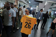 Taybah Fleurs, Luke Fleurs' cousin, arrives at the memorial service for the slain Kaizer Chiefs defender at FNB Stadium in Johannesburg.