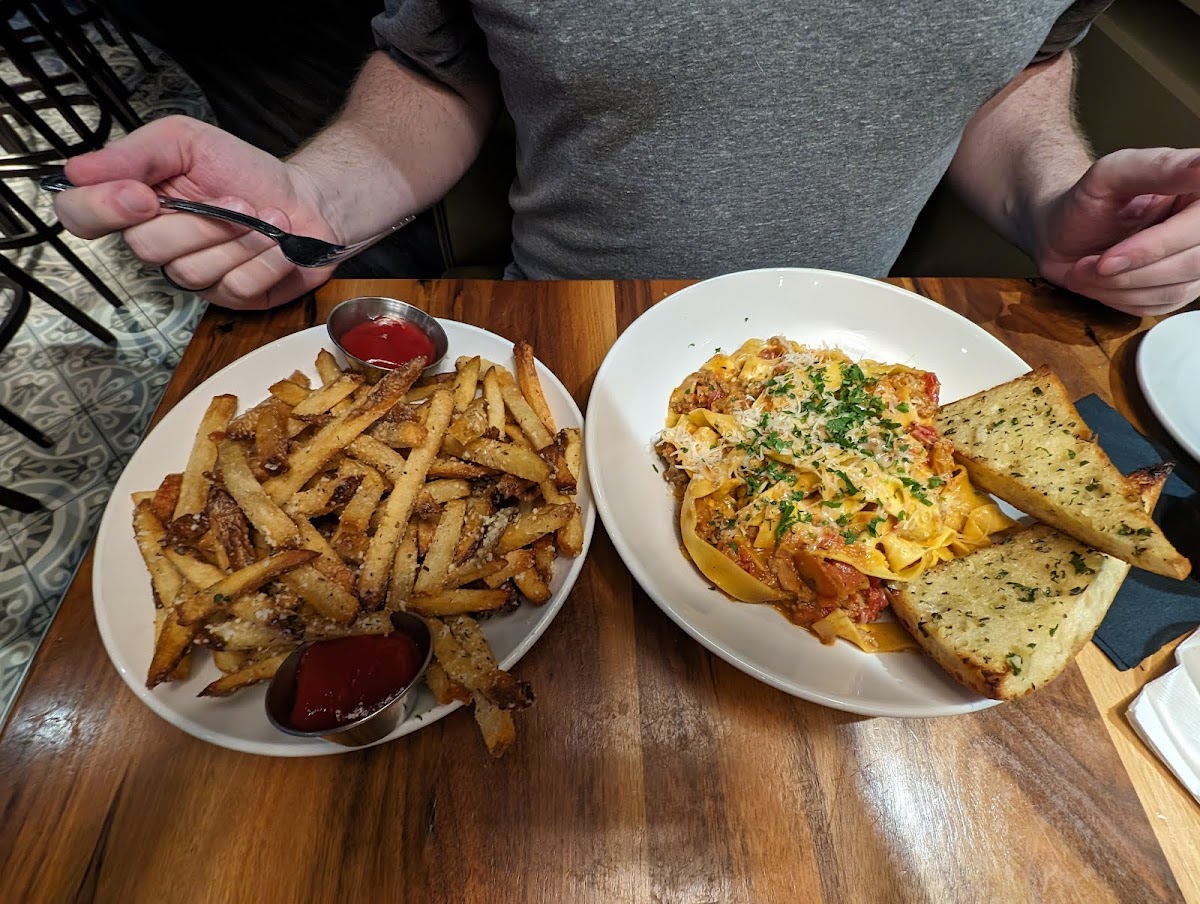 Gluten free Parmesan truffle fries and not gluten free Bolognese pasta (but they do offer a gluten free version of this dish).