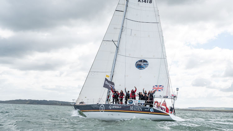 The crew of Maiden cross the finish line in England after sailing around the world to raise awareness of education for girls