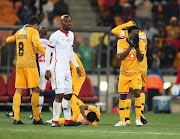 Kaizer Chiefs midfielder Siphelele Ntshangase react in anguish after witnessing a horrific injury to his teammate Joseph Molangoane (lying on floor) during the MTN8 3-0 quarterfinal win over  Free State Stars at FNB Stadium on August 11 2018.  