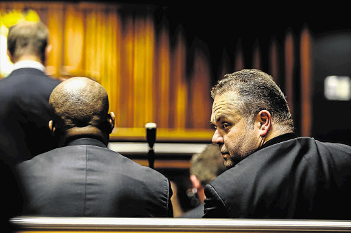 Radovan Krejcir, right, and Desai Luphondo in the Palm Ridge Magistrate's Court in Katlehong yesterday, applying for bail. They and two policemen are accused of kidnap and assault