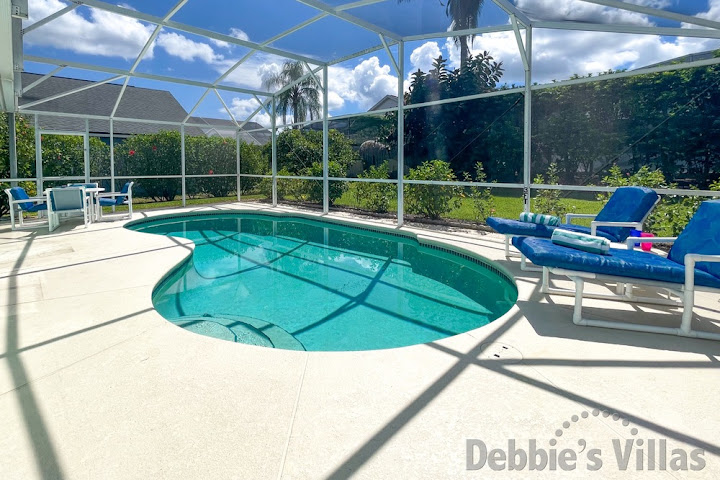 Peaceful, south-facing pool deck at this Kissimmee vacation villa