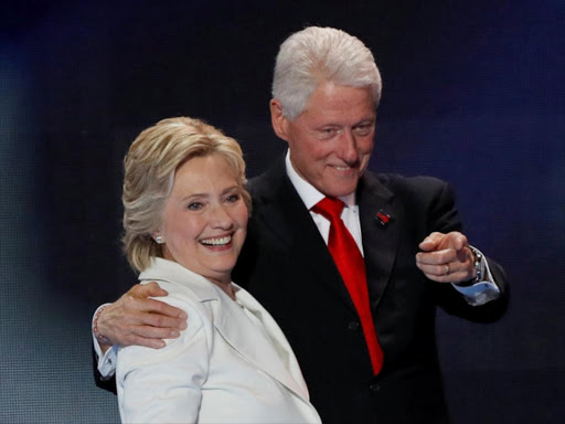 US Democratic presidential nominee Hillary Clinton stands with her husband, former President Bill Clinton, after accepting the nomination on the final night of the Democratic National Convention in Philadelphia, Pennsylvania, US July 28, 2016. /REUTERS