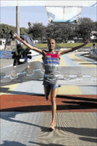 October 05, 2014. Lusapho April winner of 21km Legends Marathon, with a time of 1hour, 3 minutes anad 13 seconds, in East London on Sunday.picture: STEPHANIE LLOYD. © DAILY DISPATCH