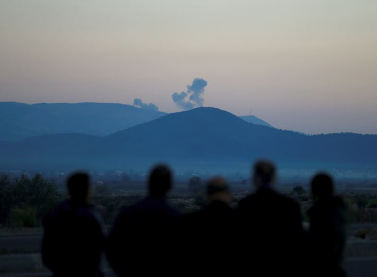 Smoke rises from the Syria's Afrin region, as it is pictured from near the Turkish town of Hassa, on the Turkish-Syrian border in Hatay province, Turkey January 20, 2018.