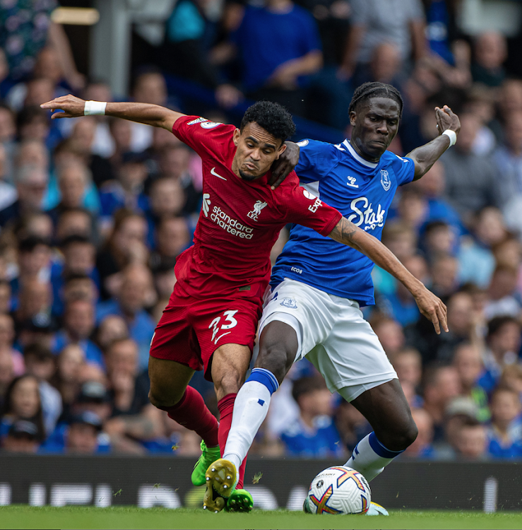 Everton's Amadou Onana (R) vies for the ball with Liverpool's Luis Diaz during a Premier League match