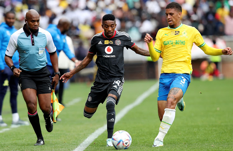 Orlando Pirates attacker Monnapule Seleng is challenged by Rushine de Reuck of Mamelodi Sundowns during their MTN8 semifinal, second leg at Peter Mokaba Stadium in Polokwane on October 22 2022.