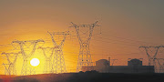 A view of the setting sun through the pylons of the Koeberg nuclear power station near Cape Town.