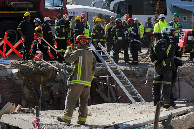 Rescue workers continued to scour the rubble of the collapsed building in Victoria Street on Wednesday, trying to recover workers presumed trapped in the debris. About 75 construction workers were on site when the building collapsed at about 2pm on Monday.