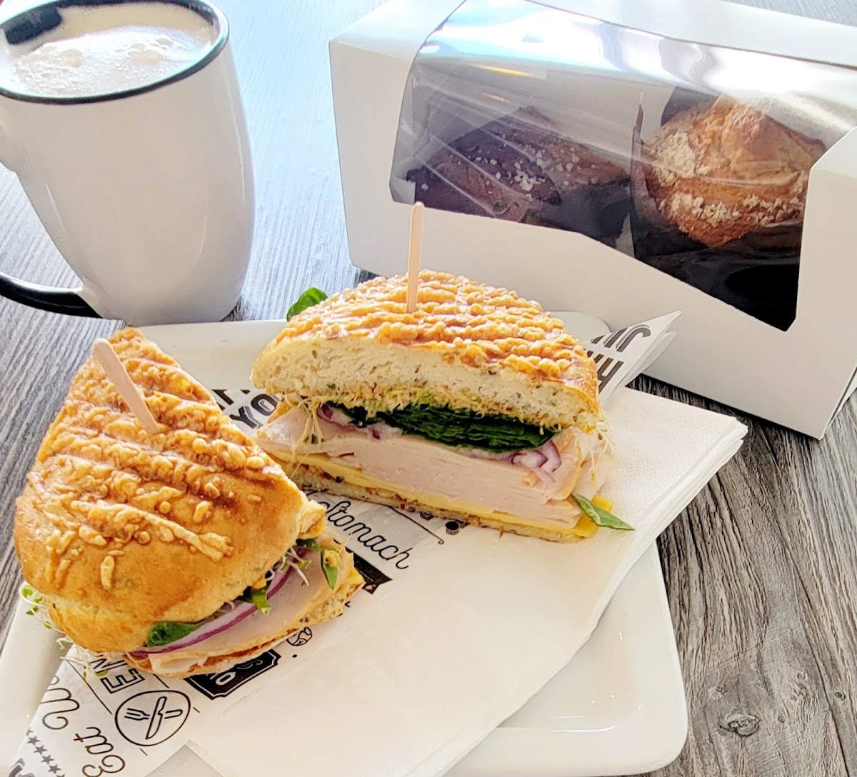 Turkey panini and latte with brownie and muffin to go