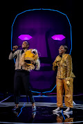 Mpho Popps and Khutso Theledi on the Masked Singer SA stage.