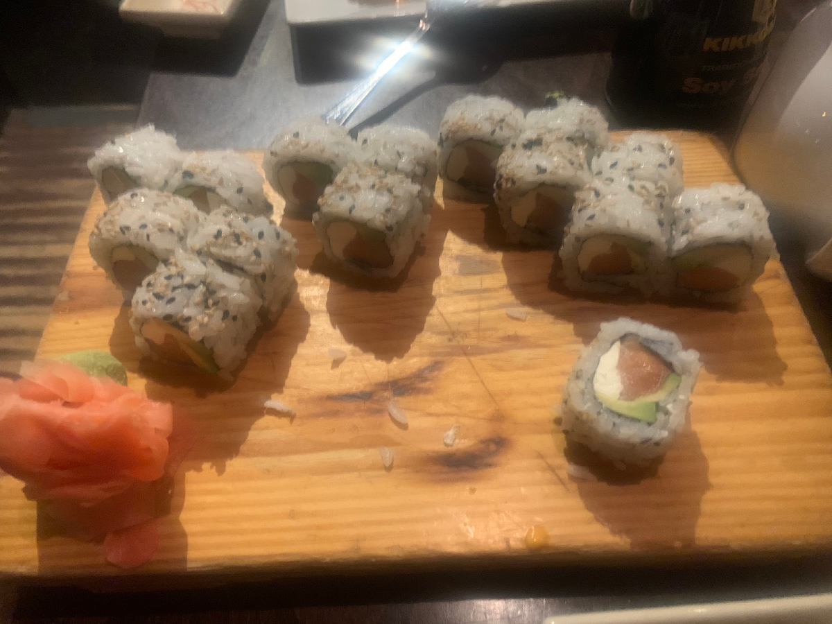 Sushi on wooden board.