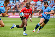 Sanele Nohamba of the Lions breaks away from Marco van Staden of the Bulls during their United Rugby Championship match at Loftus.