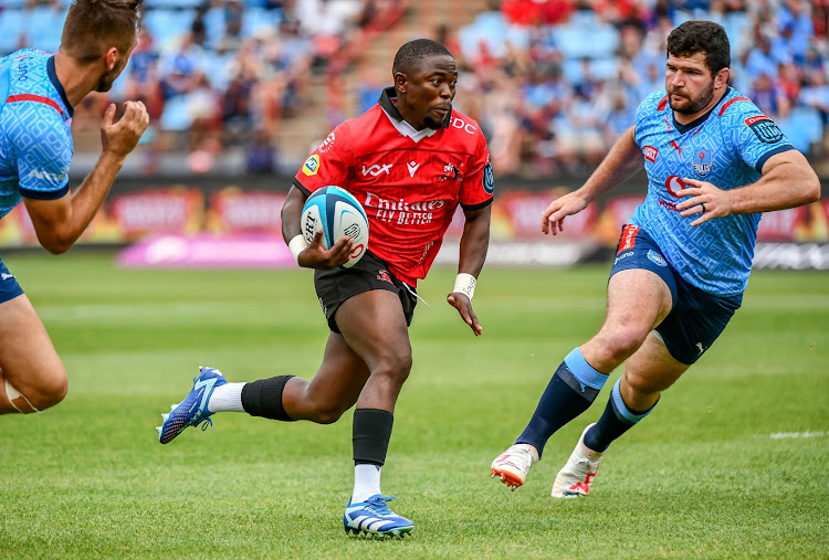 Sanele Nohamba of the Lions breaks away from Marco van Staden of the Bulls during their United Rugby Championship match at Loftus.