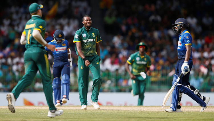 South Africa's Andile Phehlukwayo celebrates after taking the wicket of Sri Lanka's Niroshan Dickwella.