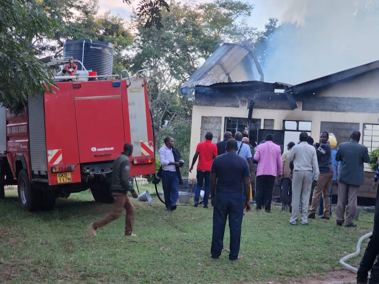 Students watch helplessly as fire gutters down a dormitory at Masii Boys High school in Mwala, Machakos County on April 2, 2024/ HANDOUT